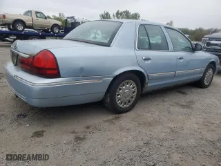 2003 Mercury Grand Marquis GS Convenience with VIN 2MEFM74W63X704603, listed as a Copart auction lot 72118014 with 128,599 mi miles and Clean Title. Bid and sale history available at carsss.com. Image 3.