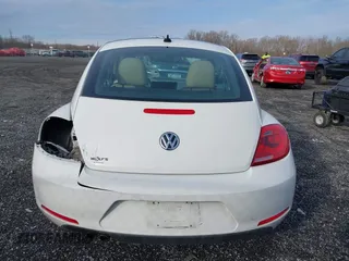 2014 Volkswagen Beetle 2.5L w/Sun with VIN 3VWJP7AT8EM611560, listed as a IAAI auction lot 41488488 with 140,798 mi miles and . Bid and sale history available at DreamBid. Image 17.