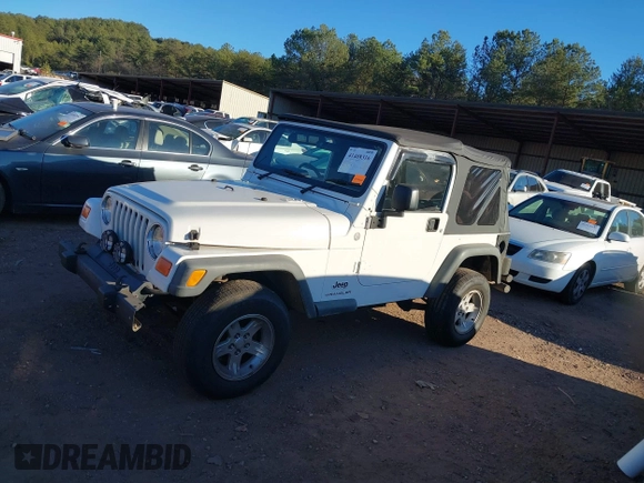 2004 Jeep Wrangler Sport Right Hand Drive with VIN 1J4F449S74P732854, listed as a IAAI auction lot 41408316 with 112,064 mi miles. Bid and sale history available at carsss.com. Image 14.