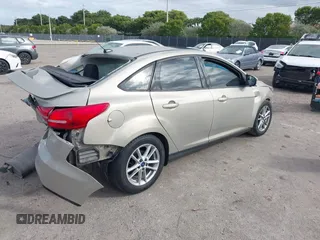 2015 Ford Focus SE with VIN 1FADP3F29FL292655, listed as a IAAI auction lot 41090945 with 106,060 mi miles. Bid and sale history available at carsss.com. Image 4.