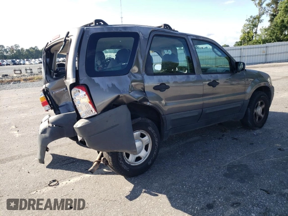 2004 Ford Escape XLS with VIN 1FMYU92134KA21707, listed as a Copart auction lot 72114804 with 219,518 mi miles and Salvage Title. Bid and sale history available at DreamBid. Image 3.