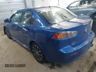 2017 Mitsubishi Lancer ES with VIN JA32V2FW4HU006890, listed as a IAAI auction lot 41636035 with 165,077 mi miles. Bid and sale history available at carsss.com. Image 3.