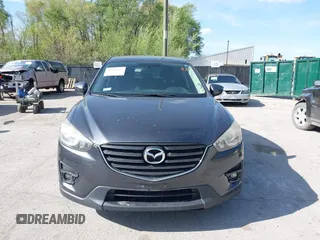 2016 Mazda CX-5 Touring z VIN JM3KE2CY4G0708972, wystawiony jako IAAI lot #42043013 z przebiegiem 157 573 mil mil oraz . Historia ofert i sprzedaży dostępna na DreamBid. Obrazek 12.