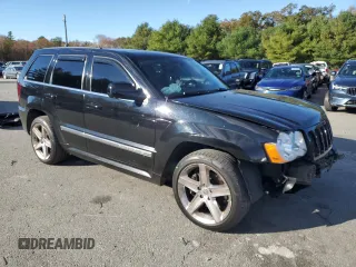 2008 Jeep Grand Cherokee SRT-8 with VIN 1J8HR78368C152318, listed as a Copart auction lot 74203604 with 157,840 mi miles and Salvage Title. Bid and sale history available at carsss.com. Image 4.