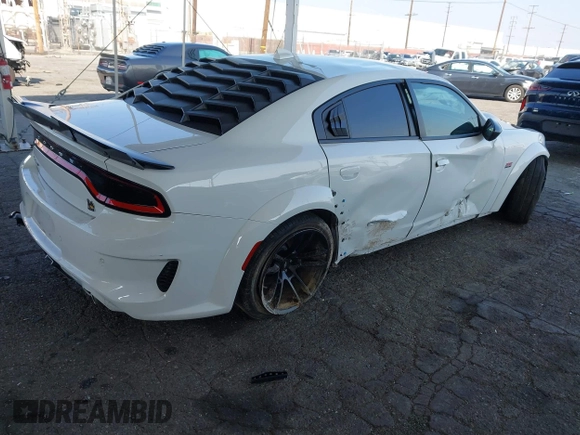 2023 Dodge Charger Scat Pack Widebody with VIN 2C3CDXGJ6PH635498, listed as a IAAI auction lot 41448100 with 13,678 mi miles and . Bid and sale history available at DreamBid. Image 4.