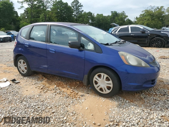 2009 Honda Fit with VIN JHMGE882X9S007865, listed as a Copart auction lot 61025875 with 159,919 mi miles and Clean title. Bid and sale history available at DreamBid. Image 4.