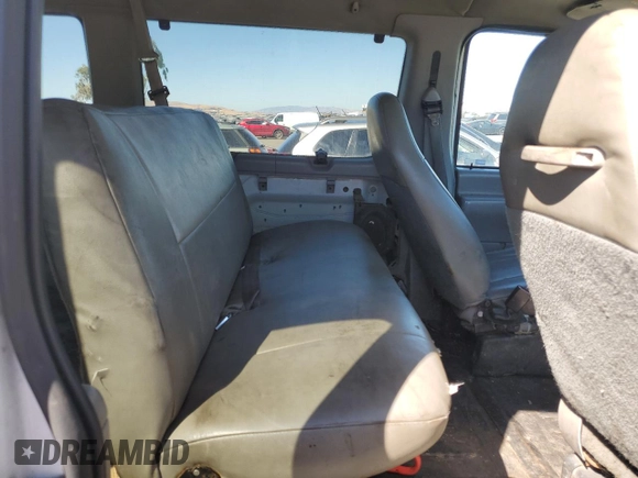 1999 Ford Econoline Wagon XL z VIN 1FBSS31SXXHB17170, wystawiony jako Copart lot #70482974 z przebiegiem 86 575 mil mil oraz Czysty tytuł • Clean title. Historia ofert i sprzedaży dostępna na DreamBid. Obrazek 11.