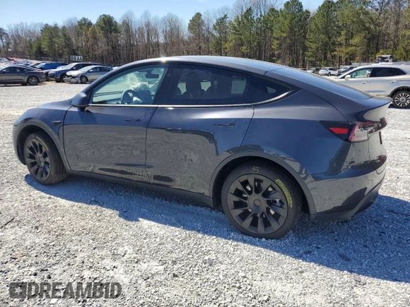 2025 Tesla Model Y Long Range with VIN 7SAYGAEEXSF253326, listed as a Copart auction lot 49527965 with 5,803 mi miles and Salvage Title. Bid and sale history available at DreamBid. Image 2.