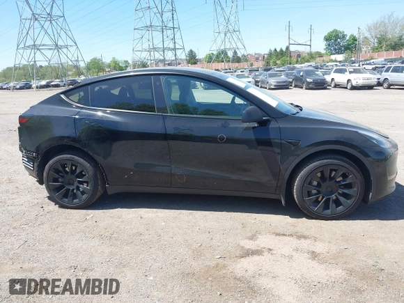 2023 Tesla Model Y Long Range with VIN 7SAYGDEE0PA111430, listed as a IAAI auction lot 42156924 with 35,950 mi miles and . Bid and sale history available at DreamBid. Image 14.