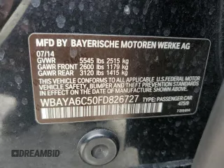 2015 BMW 7 Series 740i with VIN WBAYA6C50FD826727, listed as a Copart auction lot 82197433 with 241,799 mi miles and . Bid and sale history available at DreamBid. Image 12.