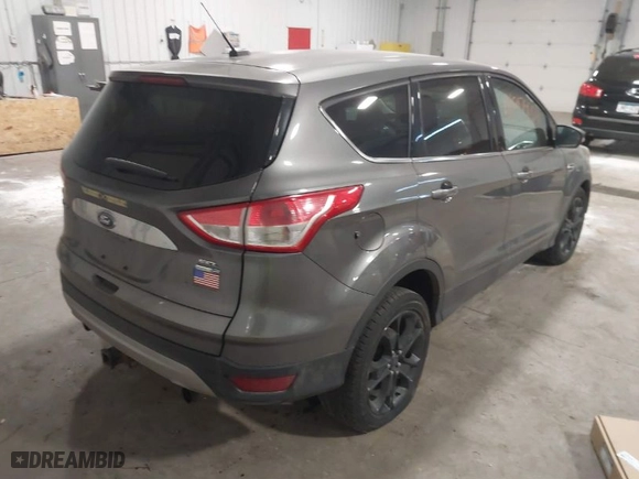 2013 Ford Escape SEL with VIN 1FMCU9H96DUC78548, listed as a IAAI auction lot 41217934 with 213,859 mi miles. Bid and sale history available at carsss.com. Image 4.