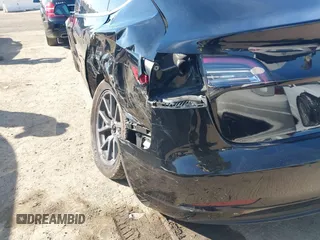 2018 Tesla Model 3 Long Range Battery with VIN 5YJ3E1EA0JF056979, listed as a IAAI auction lot 41865849 with 97,319 mi miles. Bid and sale history available at carsss.com. Image 19.