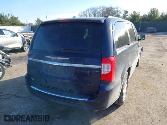 2013 Chrysler Town & Country Touring with VIN 2C4RC1BG1DR573211, listed as a IAAI auction lot 41070692 with 143,913 mi miles. Bid and sale history available at carsss.com. Image 4.