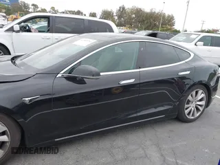 2017 Tesla Model S 100D with VIN 5YJSA1E26HF197176, listed as a IAAI auction lot 42565791 with 120,287 mi miles and . Bid and sale history available at DreamBid. Image 14.