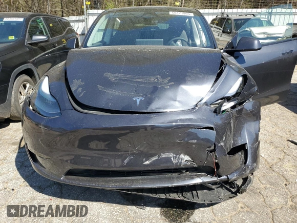 2024 Tesla Model Y Long Range z VIN 7SAYGDEE3RA323029, wystawiony jako Copart lot #50171805 z przebiegiem Nie podano mil oraz Szkoda całkowita • Salvage title. Historia ofert i sprzedaży dostępna na DreamBid. Obrazek 5.