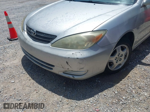 2002 Toyota Camry XLE z VIN 4T1BF32K42U531992, wystawiony jako IAAI lot #42294926 z przebiegiem 294 929 mil mil oraz . Historia ofert i sprzedaży dostępna na DreamBid. Obrazek 6.
