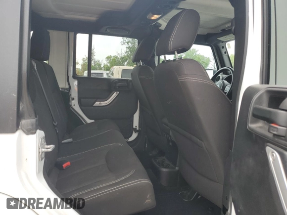 2014 Jeep Wrangler Unlimited Sahara with VIN 1C4BJWEG8EL266340, listed as a Copart auction lot 57809465 with 121,191 mi miles and Salvage title. Bid and sale history available at DreamBid. Image 11.