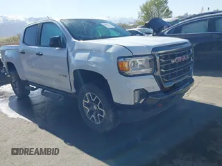 2021 GMC Canyon 4WD AT4 z VIN 1GTG6FEN4M1196416, wystawiony jako IAAI lot #42001473 z przebiegiem 87 246 mil mil oraz . Historia ofert i sprzedaży dostępna na DreamBid. Obrazek 1.