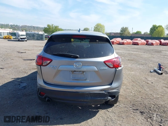 2014 Mazda CX-5 Grand Touring with VIN JM3KE4DY7E0311893, listed as a IAAI auction lot 42090872 with 102,154 mi miles and . Bid and sale history available at DreamBid. Image 16.