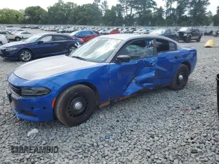 2020 Dodge Charger Police with VIN 2C3CDXKT0LH127370, listed as a Copart auction lot 55323385 with 57,425 mi miles and Salvage title. Bid and sale history available at DreamBid. Image 1.
