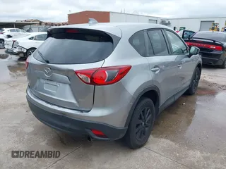 2014 Mazda CX-5 Touring z VIN JM3KE2CY8E0369145, wystawiony jako IAAI lot #42462985 z przebiegiem 155 480 mil mil oraz . Historia ofert i sprzedaży dostępna na DreamBid. Obrazek 4.
