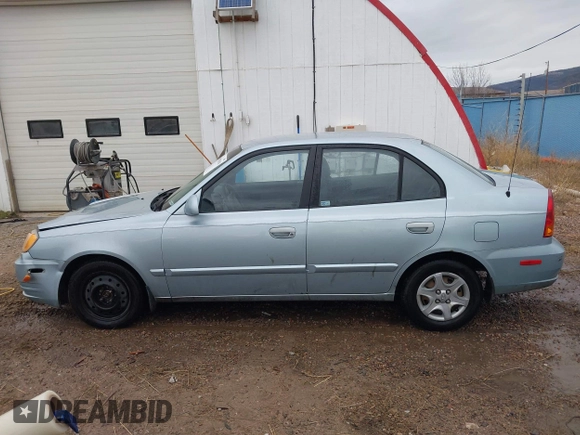 2003 Hyundai Accent GL z VIN KMHCG45C43U465523, wystawiony jako IAAI lot #40883056 z przebiegiem 95 770 mil mil oraz . Historia ofert i sprzedaży dostępna na DreamBid. Obrazek 14.