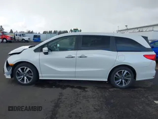 2022 Honda Odyssey Touring with VIN 5FNRL6H8XNB057293, listed as a IAAI auction lot 41826014 with 30,454 mi miles and . Bid and sale history available at DreamBid. Image 14.