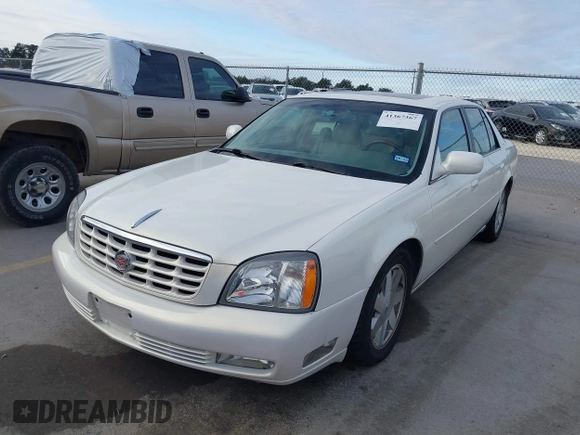 2004 Cadillac DeVille DTS z VIN 1G6KF579X4U238691, wystawiony jako IAAI lot #41367367 z przebiegiem 69 902 mil mil oraz . Historia ofert i sprzedaży dostępna na DreamBid. Obrazek 2.