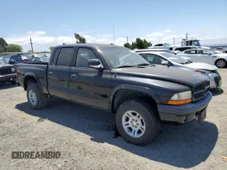 2001 Dodge Dakota Sport z VIN 1B7HG2AN61S316996, wystawiony jako Copart lot #58677535 z przebiegiem 164 628 mil mil oraz Tytuł czysty. Historia ofert i sprzedaży dostępna na DreamBid. Obrazek 4.