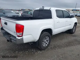 2017 Toyota Tacoma SR5 with VIN 3TMAZ5CN9HM040066, listed as a IAAI auction lot 41490470 with 119,221 mi miles. Bid and sale history available at carsss.com. Image 4.