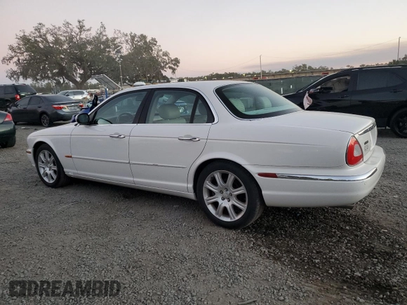 2004 Jaguar XJ with VIN SAJWA71C14SG16264, listed as a Copart auction lot 83251554 with 267,493 mi miles and Salvage Title. Bid and sale history available at carsss.com. Image 2.