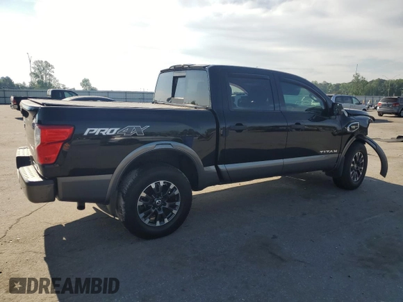 2017 Nissan Titan Platinum Reserve with VIN 1N6AA1E53HN569660, listed as a Copart auction lot 54409625 with 98,858 mi miles and Salvage title. Bid and sale history available at DreamBid. Image 3.