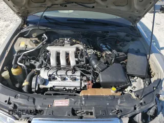 1999 Mazda Millenia z VIN JM1TA2217X1502746, wystawiony jako Copart lot #72165894 z przebiegiem 196 957 mil mil oraz Szkody całkowita. Historia ofert i sprzedaży dostępna na DreamBid. Obrazek 11.