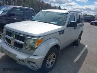 2011 Dodge Nitro SE with VIN 1D4PU2GKXBW508467, listed as a IAAI auction lot 42061484 with 100,295 mi miles. Bid and sale history available at carsss.com. Image 2.
