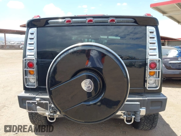 2003 Hummer H2 with VIN 5GRGN23U73H122756, listed as a IAAI auction lot 42194176 with 239,411 mi miles. Bid and sale history available at carsss.com. Image 16.
