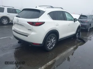 2020 Mazda CX-5 Grand Touring with VIN JM3KFBDMXL0785865, listed as a IAAI auction lot 41567177 with 64,519 mi miles. Bid and sale history available at carsss.com. Image 4.