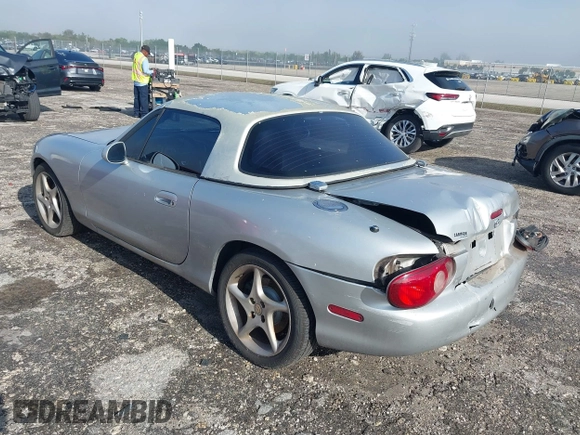 2003 Mazda MX-5 Miata Cloth with VIN JM1NB353730311899, listed as a IAAI auction lot 41929811 with 99,589 mi miles and . Bid and sale history available at DreamBid. Image 3.
