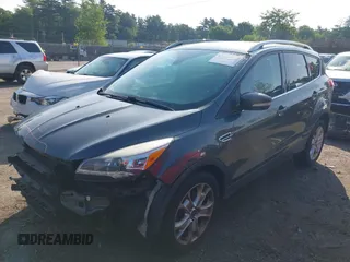 2016 Ford Escape Titanium with VIN 1FMCU9J99GUB27573, listed as a IAAI auction lot 42445457 with 156,784 mi miles and . Bid and sale history available at DreamBid. Image 2.