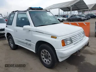 1995 Suzuki Sidekick z VIN 2S3TA02C5S6416378, wystawiony jako IAAI lot #42409391 z przebiegiem 161 738 mil mil oraz . Historia ofert i sprzedaży dostępna na DreamBid. Obrazek 1.