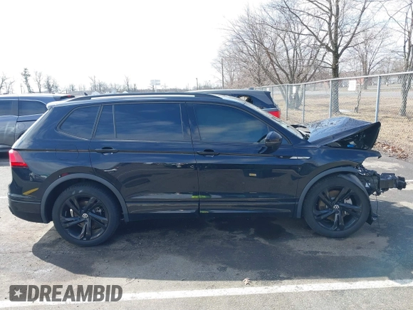 2023 Volkswagen Tiguan SE R-Line Black with VIN 3VVCB7AXXPM094621, listed as a IAAI auction lot 41737103 with 21,069 mi miles and . Bid and sale history available at DreamBid. Image 13.