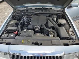 2005 Mercury Grand Marquis GS z VIN 2MEFM74W45X611002, wystawiony jako Copart lot #56645615 z przebiegiem 141 059 mil mil oraz Tytuł czysty. Historia ofert i sprzedaży dostępna na DreamBid. Obrazek 11.