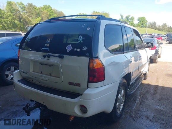 2003 GMC Envoy SLT with VIN 1GKDT13S432190085, listed as a IAAI auction lot 42106915 with 289,933 mi miles. Bid and sale history available at carsss.com. Image 4.