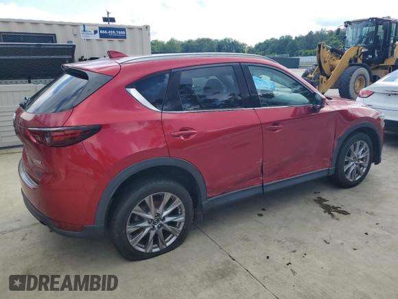 2019 Mazda CX-5 Grand Touring with VIN JM3KFADM2K1657915, listed as a Copart auction lot 56647145 with 85,095 mi miles and Salvage title. Bid and sale history available at DreamBid. Image 3.