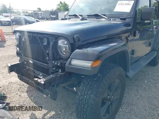2020 Jeep Wrangler Unlimited Sahara High Altitude with VIN 1C4HJXEGXLW182581, listed as a IAAI auction lot 42612084 with 52,656 mi miles and . Bid and sale history available at DreamBid. Image 18.