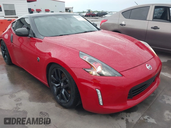 2016 Nissan 370Z z VIN JN1AZ4EHXGM932681, wystawiony jako IAAI lot #42350850 z przebiegiem 94 586 mil mil oraz . Historia ofert i sprzedaży dostępna na DreamBid. Obrazek 1.