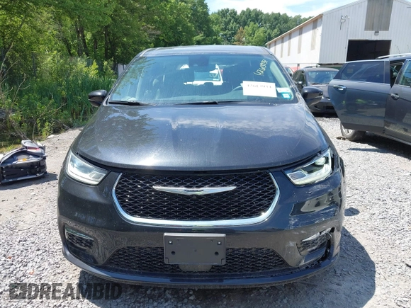2023 Chrysler Pacifica Touring L with VIN 2C4RC1BG2PR534194, listed as a IAAI auction lot 42613934 with 69,896 mi miles and . Bid and sale history available at DreamBid. Image 12.