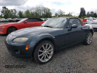 2006 Mazda MX-5 Miata Touring with VIN JM1NC25F260109543, listed as a Copart auction lot 56950695 with 143,633 mi miles and Salvage title. Bid and sale history available at DreamBid. Image 1.