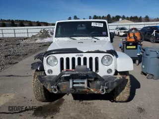 2014 Jeep Wrangler Sahara with VIN 1C4AJWBGXEL125544, listed as a Copart auction lot 51961845 with 146,917 mi miles and Salvage title. Bid and sale history available at DreamBid. Image 5.
