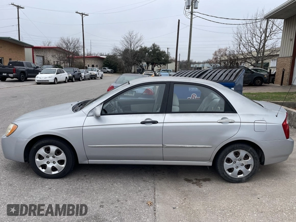 2004 Kia Spectra LX with VIN KNAFE121845043143, listed as a IAAI auction lot 41574523 with 211,758 mi miles. Bid and sale history available at carsss.com. Image 13.
