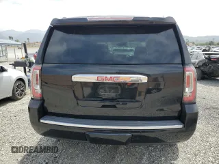 2015 GMC Yukon Denali z VIN 1GKS2CKJ9FR609462, wystawiony jako Copart lot #56685575 z przebiegiem 125 679 mil mil oraz Szkoda całkowita • Salvage title. Historia ofert i sprzedaży dostępna na DreamBid. Obrazek 6.
